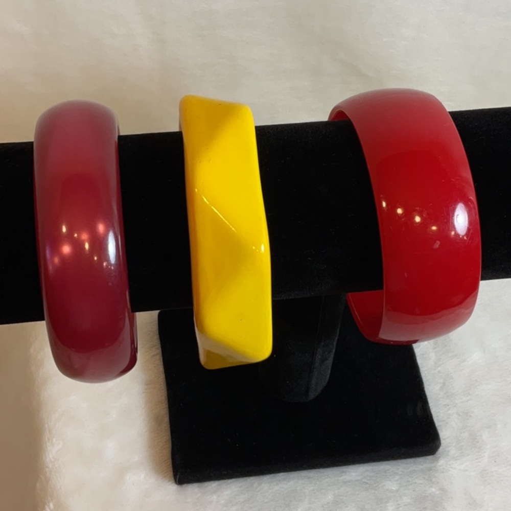 Plastic bangle bracelets. Set of three wide. Various colors.
